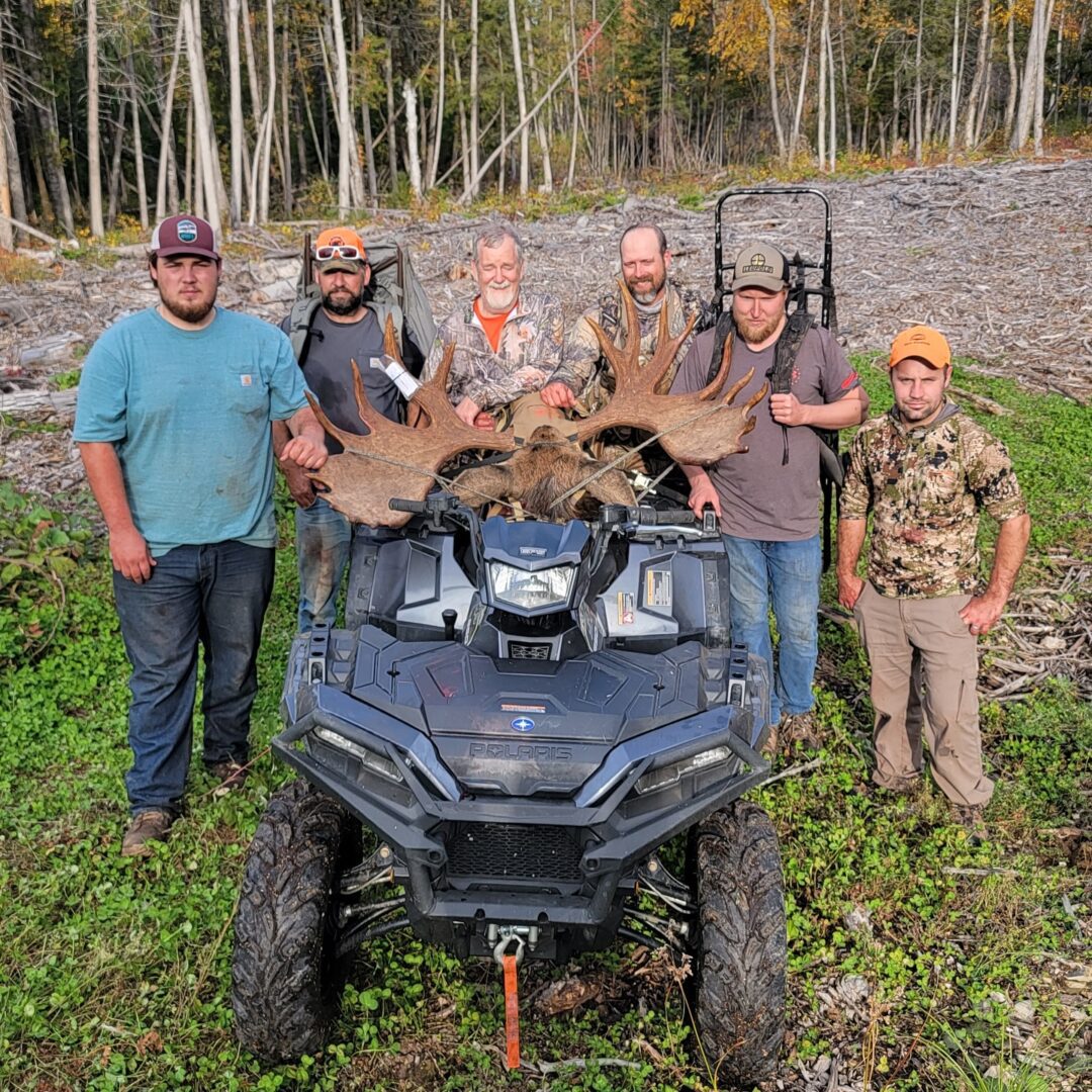 Group of men with a harvested moose.